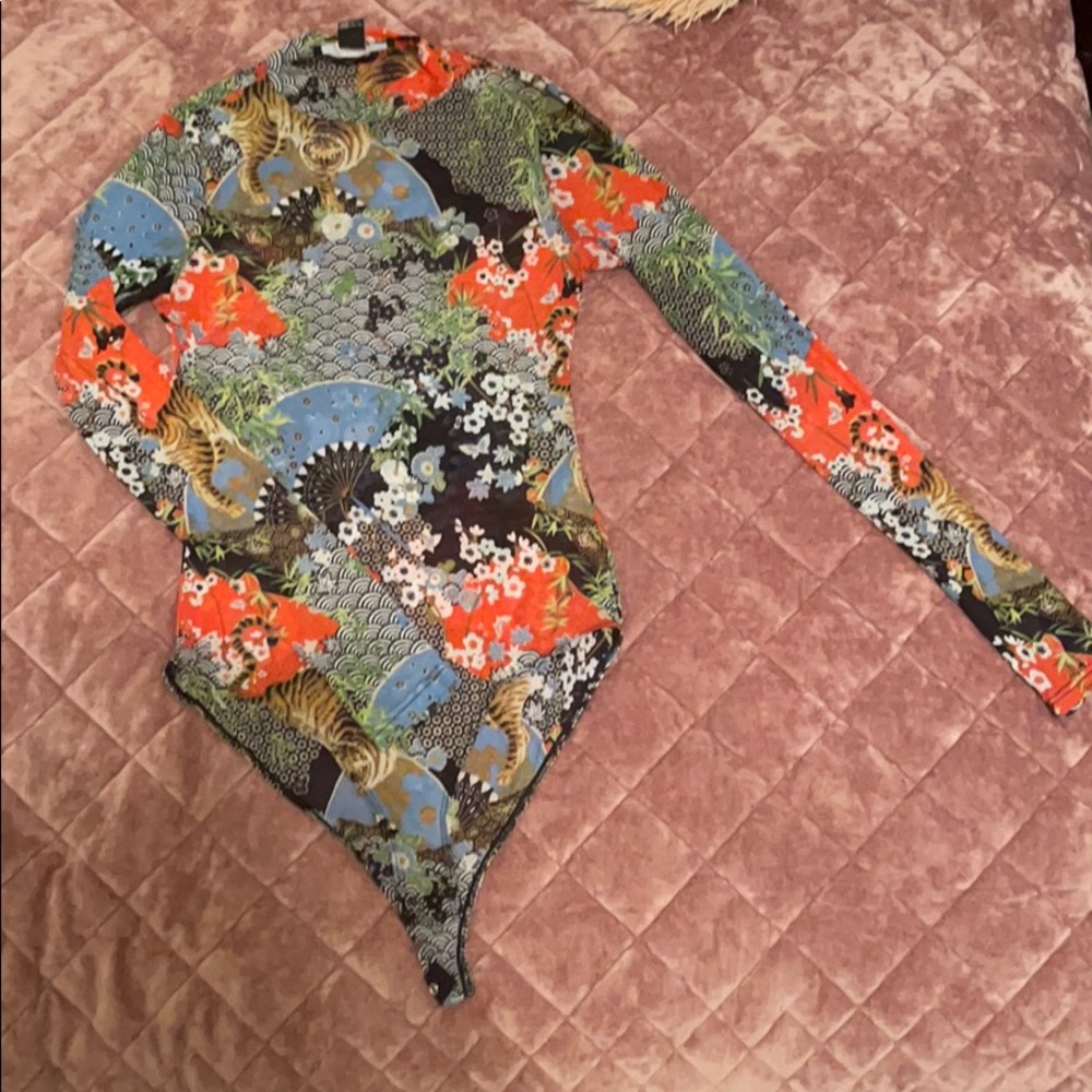 It’s a sheer one piece with details.